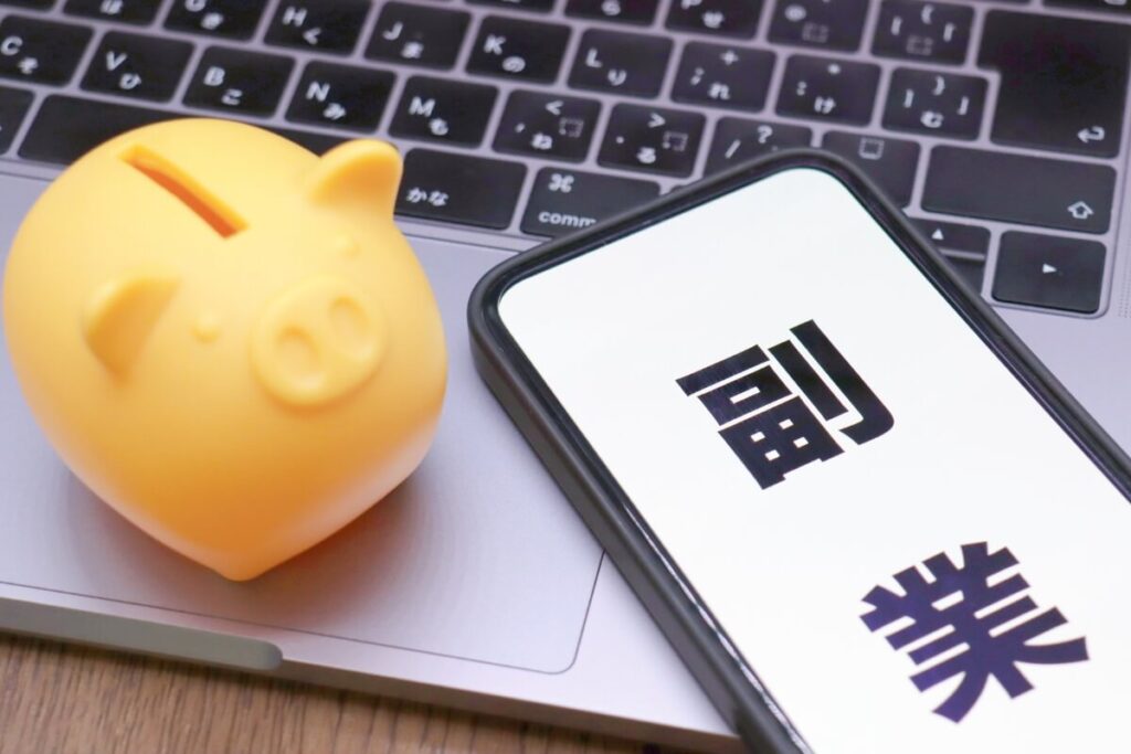 piggy bank and cellphone with japanese writing